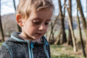 Portrait of young boy in forest